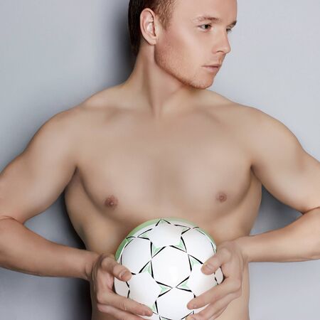 muscle man with soccer ball.handsome manの写真素材
