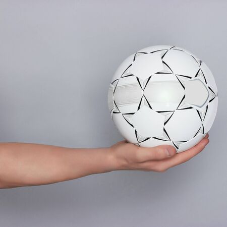 male hand holding ball. Football soccerの写真素材