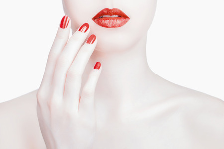 Red  Lips and Nails closeup.Young woman with Manicure and Makeup. Make-up concept. の写真素材