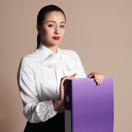 beauty business woman.beautiful girl in formal wear.accountant with a folderの写真素材