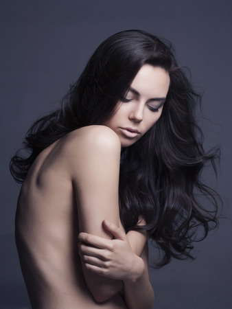 naked beautiful young woman. sexy girl with long healthy hairの写真素材