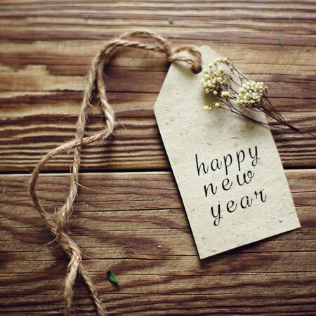 happy new year. wooden background with festive garland card.christmas readyの写真素材