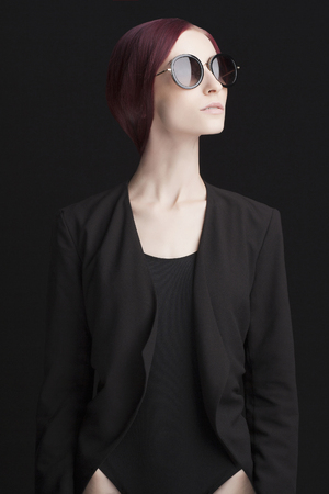Studio fashion photo of beautiful stylish woman in sunglasses. pretty young model girlの写真素材