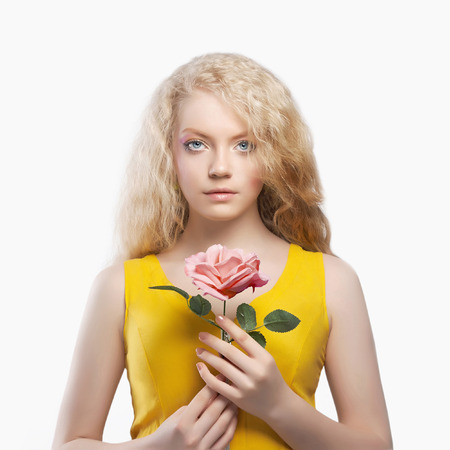 beautiful blond young woman with flower. isolated beauty spring girlの写真素材