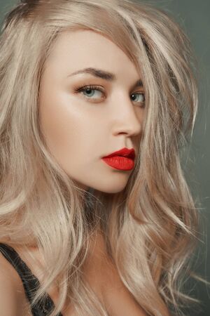 beautiful blond young woman.beauty sexy girl with make-up and healthy hairの写真素材