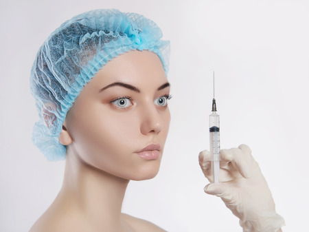 Young woman with Botox injections in the syringe.girls cosmetologyの写真素材
