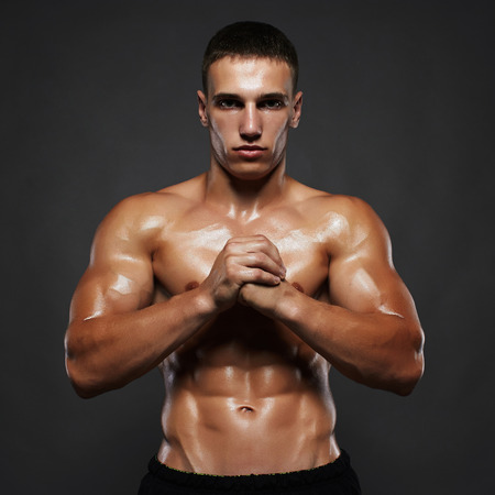 handsome athletic man.muscular fitness boy, trained body.healthy lifestyle.bodybuilding sportの写真素材