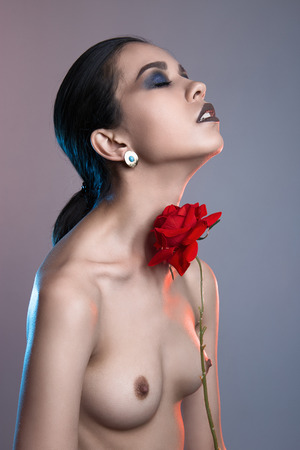 beautiful nude woman with flower.pure make-up fashion art photo of perfect body naked girlの写真素材