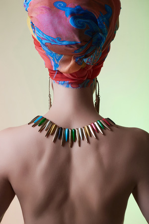 sexy back of naked woman in turban. Fashion photo.Beauty lady with colored turbanの写真素材