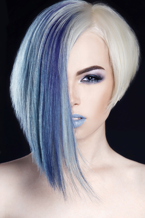 beautiful blond woman with hairstyle.Girl with colored blue hair and make-upの写真素材