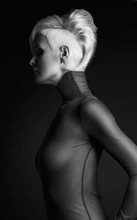 young woman with stylish haircut. beautiful blond girl with short hair and salon hairstyleの写真素材