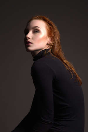 Beautiful girl with wet red Hair. beauty fashion woman portraitの写真素材