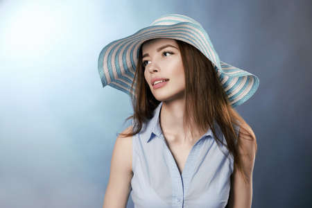 Happy beautiful woman in hat. smiling girl with make-up and Hat. beauty fashion portrait