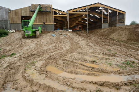 Normandiy, France, May 2013.
Construction of a new farm building for cows breeding with wood frame...
