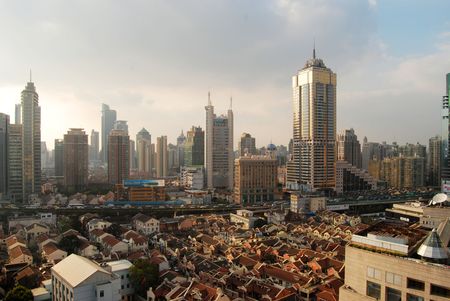 tall bulidings and modest houses in Shanghai