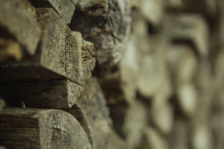 Pile of wood prepared for fuel, stacked and ready for winter, background texture.の写真素材