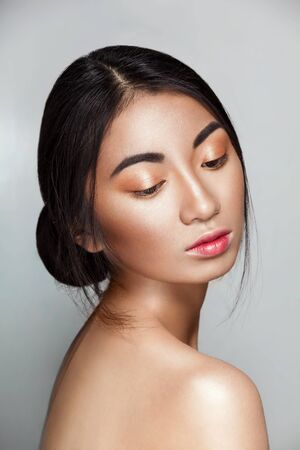 Beautiful Asian woman with shiny skin, Pocahontas styleの写真素材
