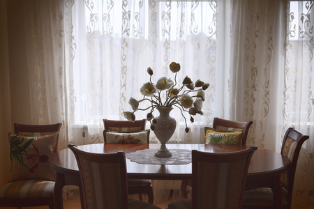 classic interior with light wallpaper and table with chairsの写真素材
