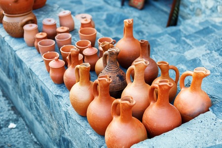 clayware souvenirs sold on a local market in the old town of Sheki, Azerbaijan on Karavan Saray...