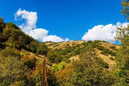 Tsaghkunyats mountain in Aghveran, Armenia. Beautiful landscape with green mountains and magnificent cloudy sky. Exploring Armeniaの写真素材
