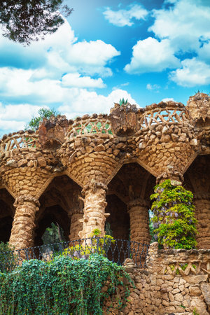 columns among the trees made of stone in Park Guell designed by Antoni Gaudi in Barcelona, Spain, modernism styleのeditorial素材