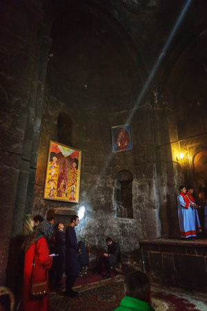 Sevan, Armenia - 25 September, 2016: Morning Mass liturgy male choir in interior of Surb Araqeloc and Astvatsatsin old Sevanavank church monasteryのeditorial素材