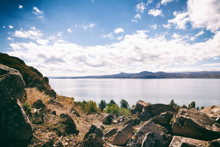Sevan lake and white clouds blue sky on a sunny day, Armeniaの写真素材