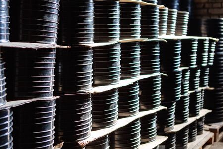 Cortex clutch. Fitting for Plastic pipes and cardboard boxes stacked in a factory or white warehouse yard for use in plumbing or sewage installationsの写真素材