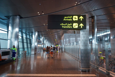 Doha, Qatar - 14 February, 2017: Interior of Hamad International Airport Terminal. Arrival transfer signsのeditorial素材