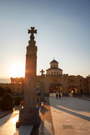 Tbilisi, Georgia - 8 October 2016: sunset view on Main gates entrance and cross to Tbilisi Sameba Cathedral Tsminda (Holy Trinity) biggest curch Orthodox Cathedral in Caucasus region, Eurasia. Exterior. Front viewのeditorial素材