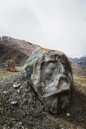 Stone face head of Rustaveli, Chavchavadze, Vazhapshavelo and Kazbegi in Sno valley in Georgia along...