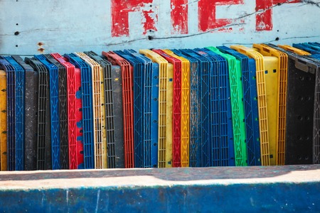stack of cargo freight containers boxes for goods on fishing boatの写真素材