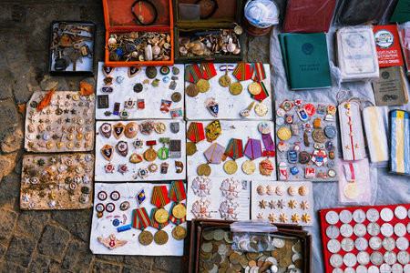 Tbilisi, Georgia - 08 October, 2016: Dry Bridge Flea market in Tbilisi sells Soviet badges and icons, retro junk stuff, old money. Dry bridge today is most famous flea market in Georgia.のeditorial素材