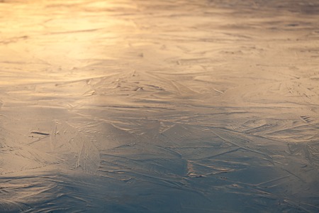 close up ice texture of wall using as background, blue and yellow tint on sunset lightの写真素材