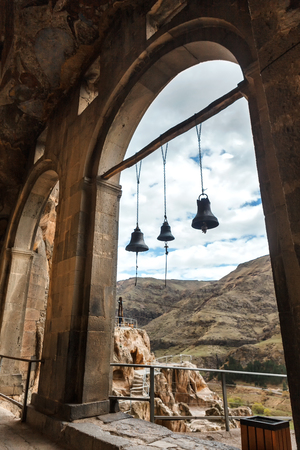 Arch bells view from Church and chapel Vardzia cave city-monastery. Vardzia was excavated in the Erusheti Mountain on the left bank of the Kura River, thirty kilometres from Aspindza, one of the main attractions of Georgiaの写真素材