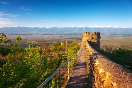View on Alazan Valley and part of the city wall with fortified tower fortress historical town...