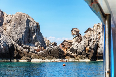 The fisherman village placed on the big rock, Moo Koh Chumphon, national park, Chumohon province, Thailand. Bird's Nest Collectors' Bungalows perched atop Ko Ngam Noiの写真素材