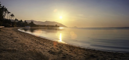 Panorama of sunset on Koh Pha Ngan island, Thong Sala beach, Thailand. Silhouette viewの写真素材