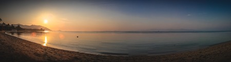 Panorama of sunset on Koh Pha Ngan island, Thong Sala beach, Thailand. Silhouette viewの写真素材