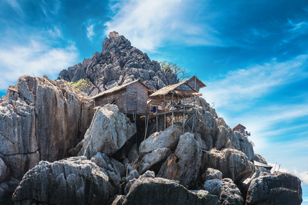 The fisherman village placed on the big rock, Moo Koh Chumphon, national park, Chumohon province, Thailand. Bird's Nest Collectors' Bungalows perched atop Ko Ngam Noiの写真素材