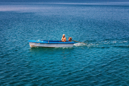 Koh Lang Ka Jew - 9 February, 2014: Old fisherman on the boat in Koh Lang Ka Jew, Chumphon Marine National Park sailsのeditorial素材