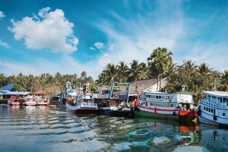 Chumphon, Thailand - 9 February 2014: Fishing boats at the coastal fishing villages. Preparation sea fishing. Sailing by Chumphon riverのeditorial素材