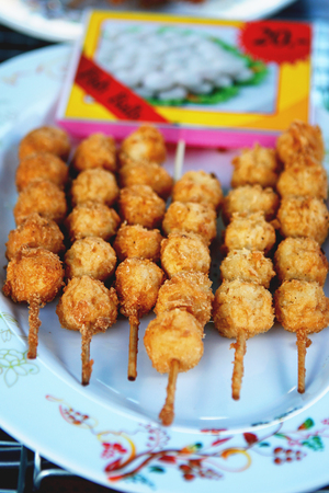Fried food with sticks, Thai style food, Thailand street food, fishball, meatball, shrimp BBQ kebabの写真素材