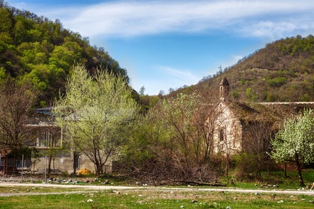 view of ruined abandoned chapel of Nice panoramic view of the fortressand church Ananuri, standing...