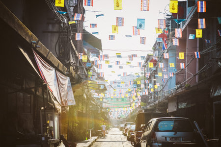 Nagkok, Thailand - January 18, 2014: Colorful commercial signboards and flags in Chinese characters at Yaowarat Road in Chinatown, Bangkok, Thailandのeditorial素材