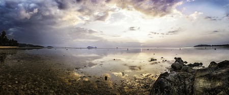 Wok Tum, Hin Kong, Plai Lem beach area of wetland with mangrove forest at Koh Pha ngan island beachfront sea shore area at low tide on sunset Gulf of Thailand. Locals harves crabs and seafoodの写真素材
