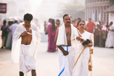 Varkala, India - February 07, 2016: Thiruvananthapuram, India - Padmanabhaswamy temple. Indian people camy for morning holy prayer. Big familyのeditorial素材