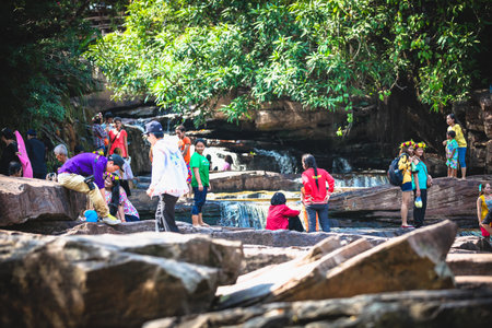 Sihanoukville, Cambodia - January 18, 2015: Kbal Chhay Waterfalls near Sihanoukville, Cambodia. Cambodian people love to rest in Bungalows near waterfallのeditorial素材
