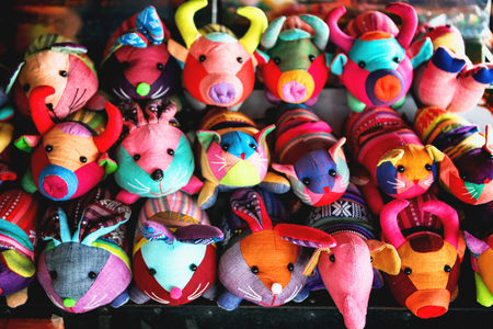 beautiful and colourful silk and cotton Indian craft toys of animals handmade sold in souvenir in Cambodian shop market stallの写真素材