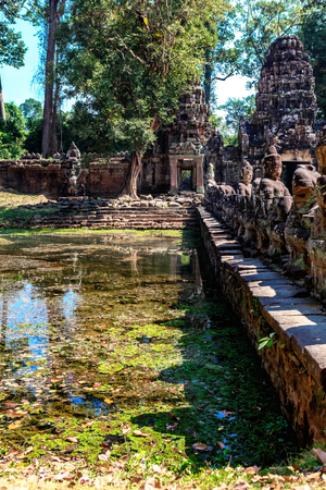 Prasat Ta Prum or Ta Prohm Temple complex, near Siem Reap, Cambodia. Huge tree roots grew on the temple entranceの写真素材